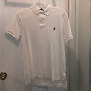 Two white and two navy blue men’s small RL polo’s.